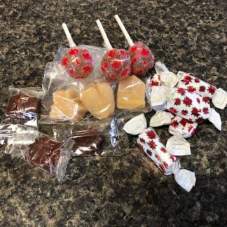 An assortment of maple candies including maple toffee, maple lollipops, maple delights, and maple sugar candies.